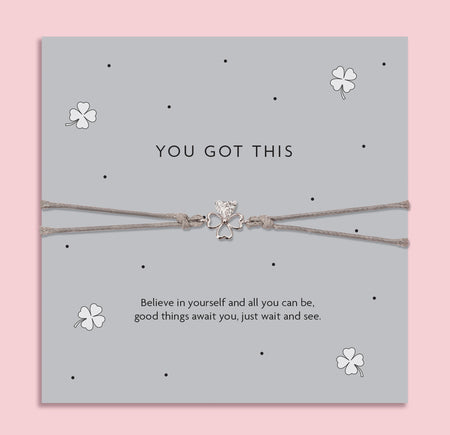 You Got This good luck bracelet with silver four leaf clover charm on grey adjustable cord, displayed on motivational card, encouragement gift for exams and students