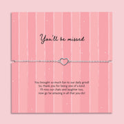 You’ll be missed heart bracelet on adjustable chain displayed on pink farewell card with message, leaving gift for colleague or friend