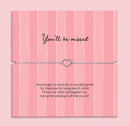 You’ll be missed heart bracelet on adjustable chain displayed on pink farewell card with message, leaving gift for colleague or friend