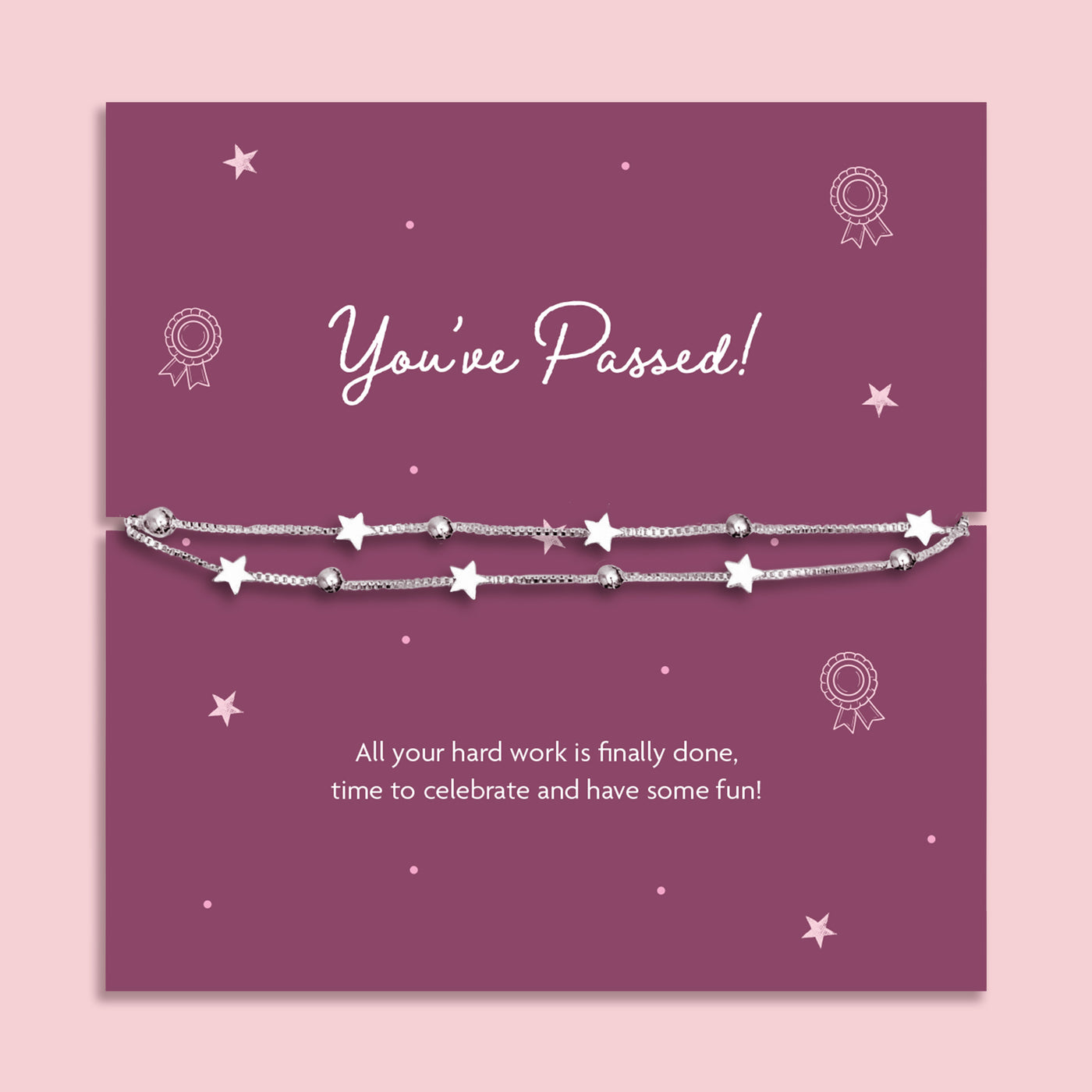 A silver star-themed beaded bracelet displayed on a purple 'You've Passed!' milestone card, set against a light pink background.