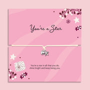 Pink card bracelet gift set with a silver heart and star charm on a cord, shown in two stacked cards with decorative stars, flowers, and inspirational text. The card reads 'you're a star', a heartfelt gift for her this Christmas