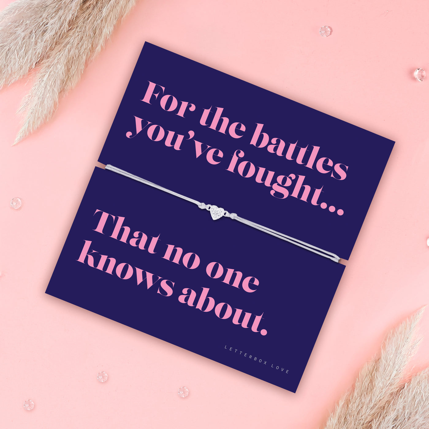 Friendship bracelet with a silver heart charm on an adjustable cord, displayed on a navy card reading “For the battles you’ve fought… that no one knows about”, a supportive bracelet for a friend and meaningful friendship gift by Letterbox Love.