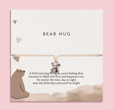 BEAR HUG' bracelet featuring a cute silver bear charm, presented on a white card with a heartwarming message and an illustrated bear.
