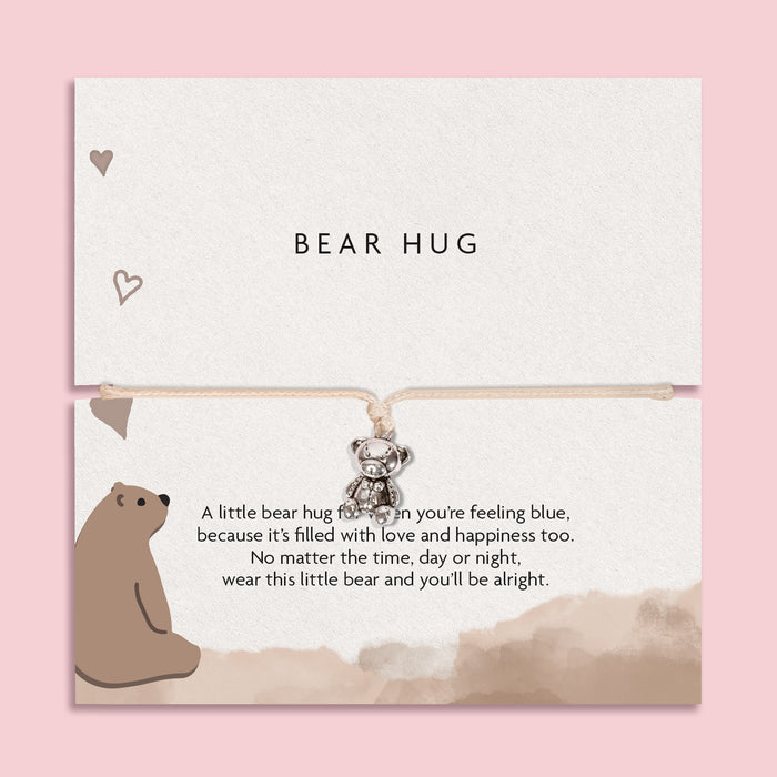 BEAR HUG' bracelet featuring a cute silver bear charm, presented on a white card with a heartwarming message and an illustrated bear.