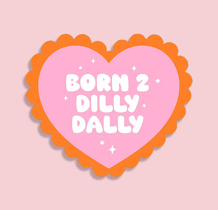 Heart-shaped pink sign with 'Born 2 Dilly Dally' text on a pink background. Cute aesthetic sticker