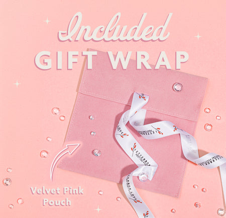 a pink gift wrap with a white ribbon