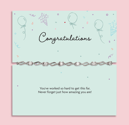 Silver plated congratulations bracelet with sparkling cubic zirconia detailing displayed on a mint-green sentiment card reading “Congratulations” and “You’ve worked so hard to get this far”, a graduation, exam results and achievement gift for her.