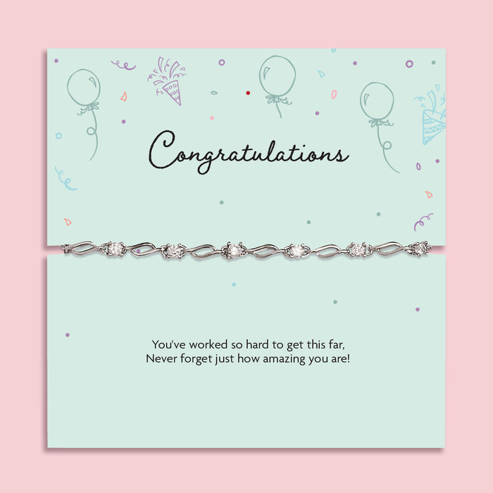 Silver plated congratulations bracelet with sparkling cubic zirconia detailing displayed on a mint-green sentiment card reading “Congratulations” and “You’ve worked so hard to get this far”, a graduation, exam results and achievement gift for her.