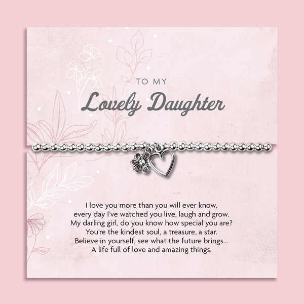 A silver beaded bracelet with a heart and flower charm displayed on a card reading "To my Beautiful Daughter" from Letterbox Love, set against a soft pink background with delicate flowers. The card features a heartfelt message, making it a thoughtful gift for a daughter.