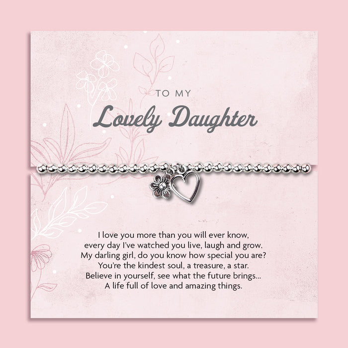 A silver beaded bracelet with a heart and flower charm displayed on a card reading "To my Beautiful Daughter" from Letterbox Love, set against a soft pink background with delicate flowers. The card features a heartfelt message, making it a thoughtful gift for a daughter.