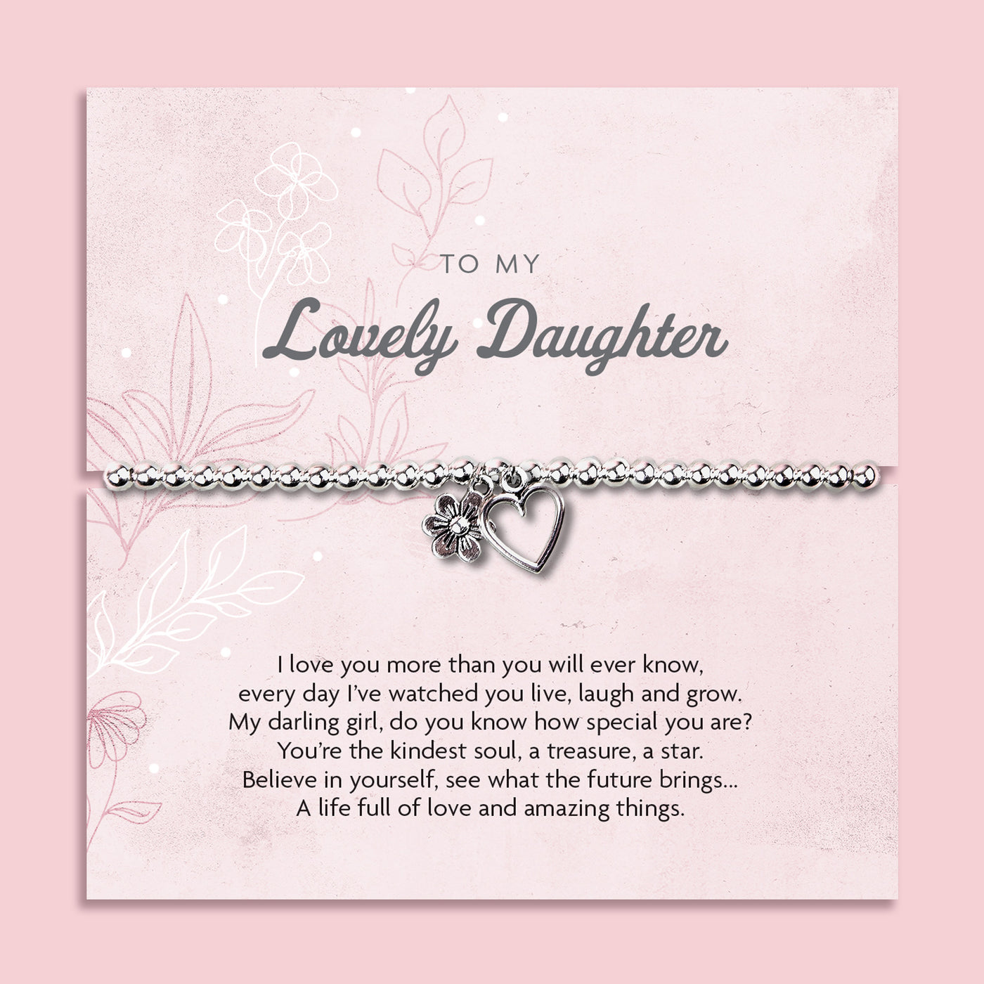 A silver beaded bracelet with a heart and flower charm displayed on a card reading 