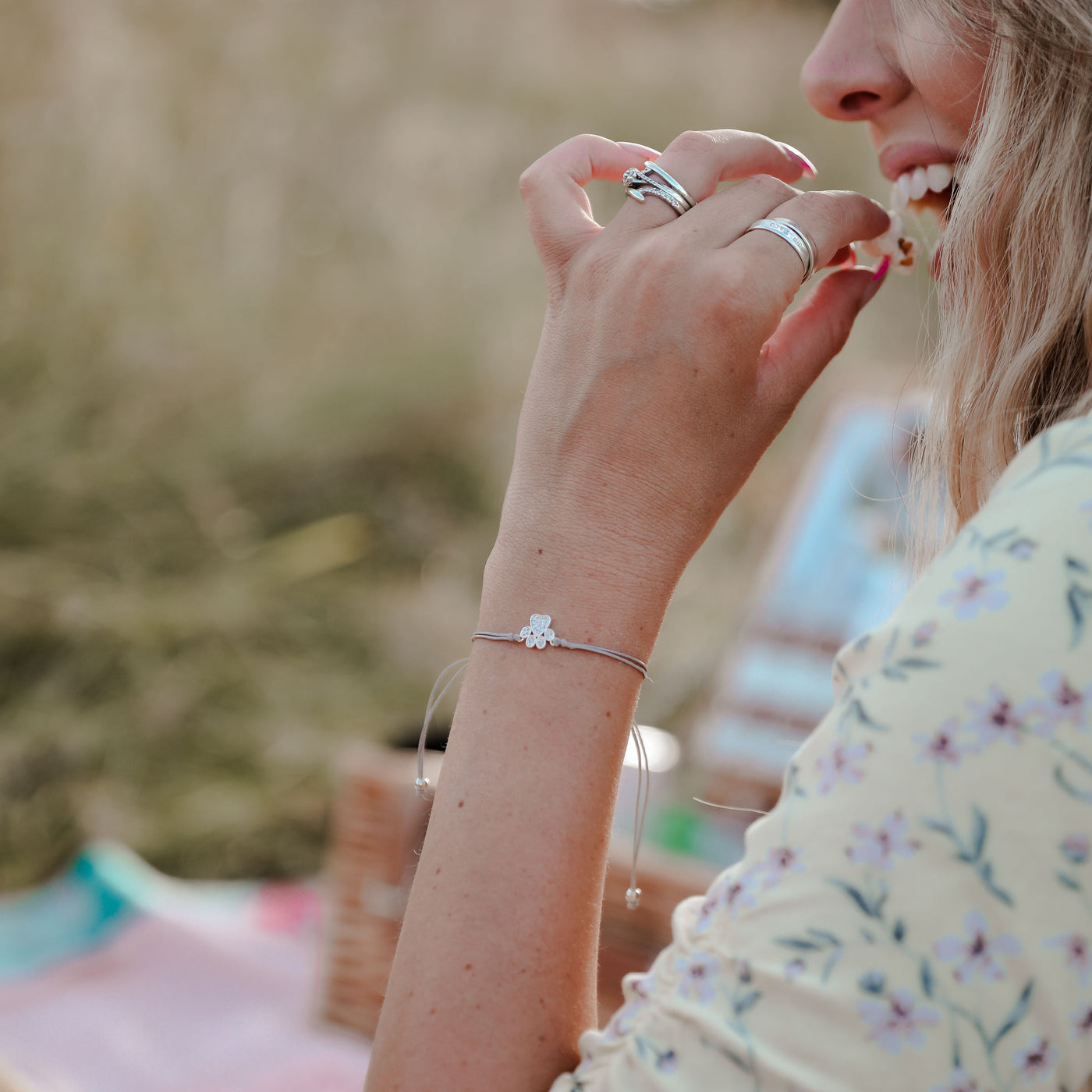 a woman is eating a piece of food