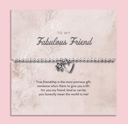 Silver beaded bracelet with heart and flower charms, displayed in a white gift box alongside a card titled 