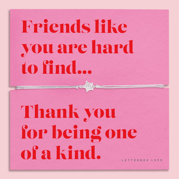 Friendship bracelet for a best friend on a pink and red card. Cute star bracelet on grey string.