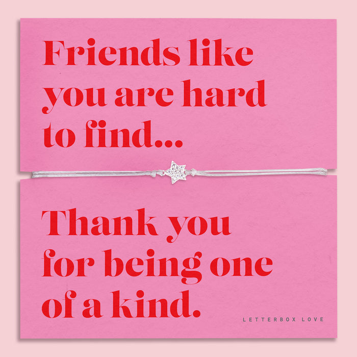 Friendship bracelet for a best friend on a pink and red card. Cute star bracelet on grey string.