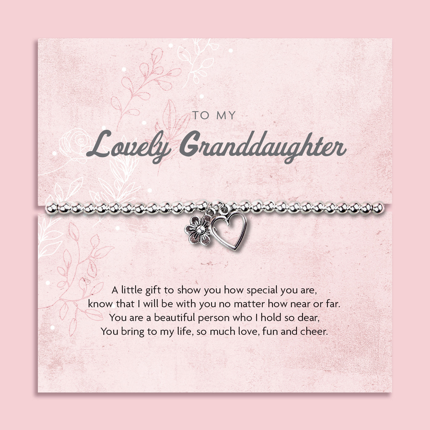 Silver beaded bracelet with heart and flower charms, presented in a white gift box alongside a card titled 