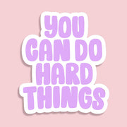 a purple and white sticker than reads 'you can do hard things', perfect for journalling