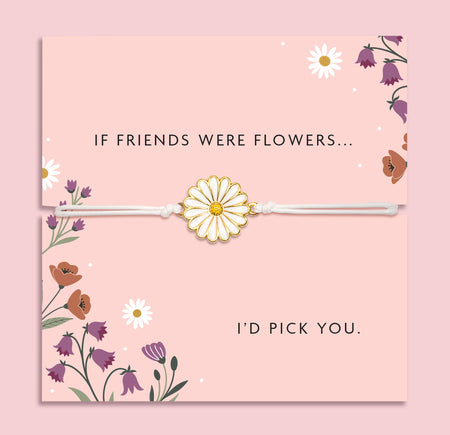 White adjustable friendship bracelet with a white enamel daisy flower charm displayed on a pink floral sentiment card reading 