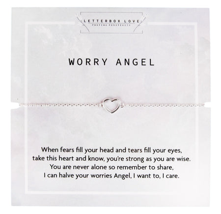 
A delicate silver chain bracelet featuring an open heart charm displayed on a card that reads 