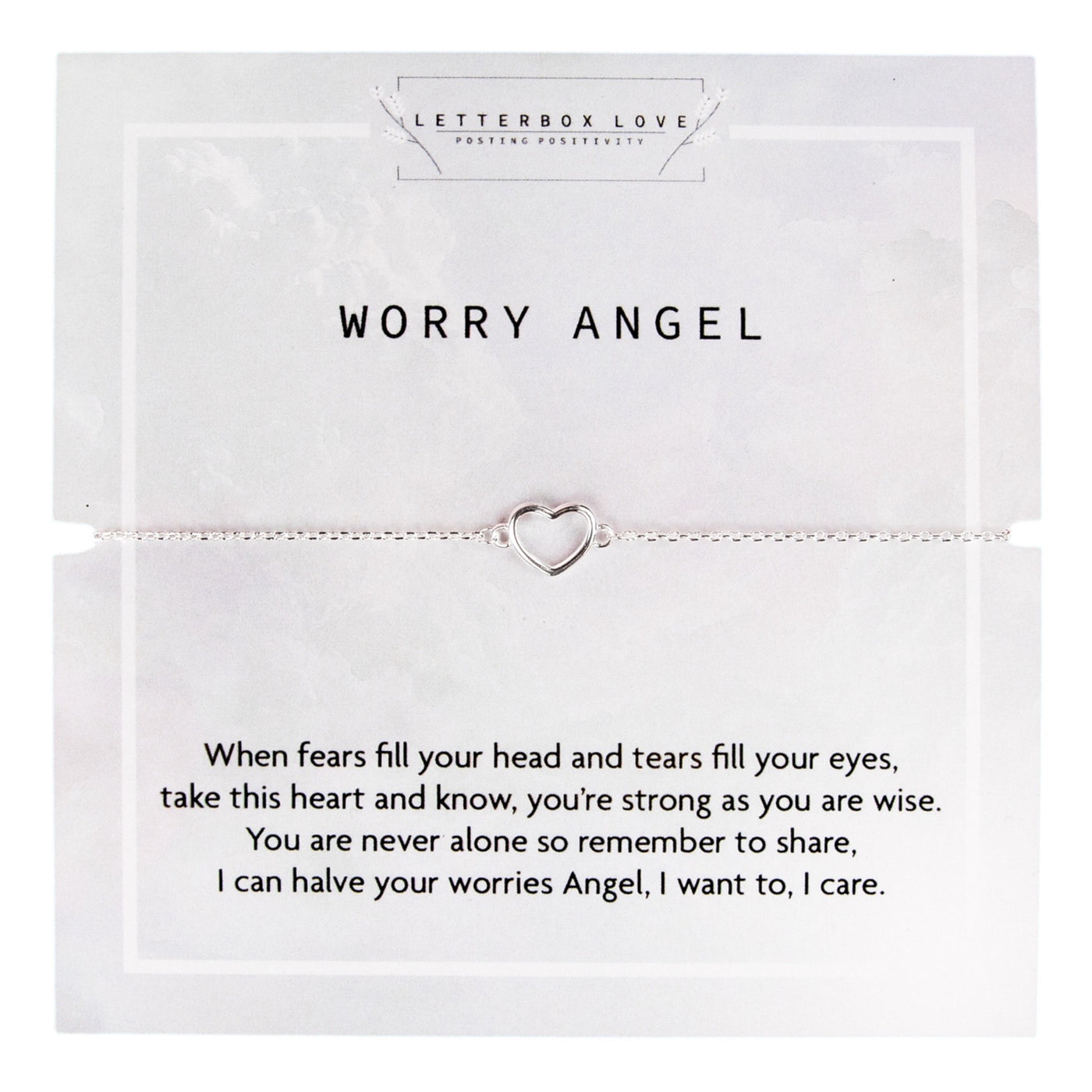 
A delicate silver chain bracelet featuring an open heart charm displayed on a card that reads 