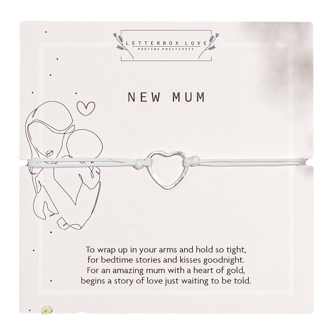 An elegant 'New Mum' bracelet with an open heart charm presented on a white card featuring a line-drawn image of a mother embracing her child and a poetic message celebrating new motherhood.