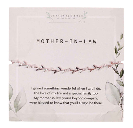 An elegant 'Mother-in-Law' silver bracelet with leaf motifs presented on a white card adorned with soft greenery illustrations. The card features a heartfelt message celebrating the special bond with a mother-in-law and comes from the 'Letterbox Love' collection, symbolizing appreciation and family unity.