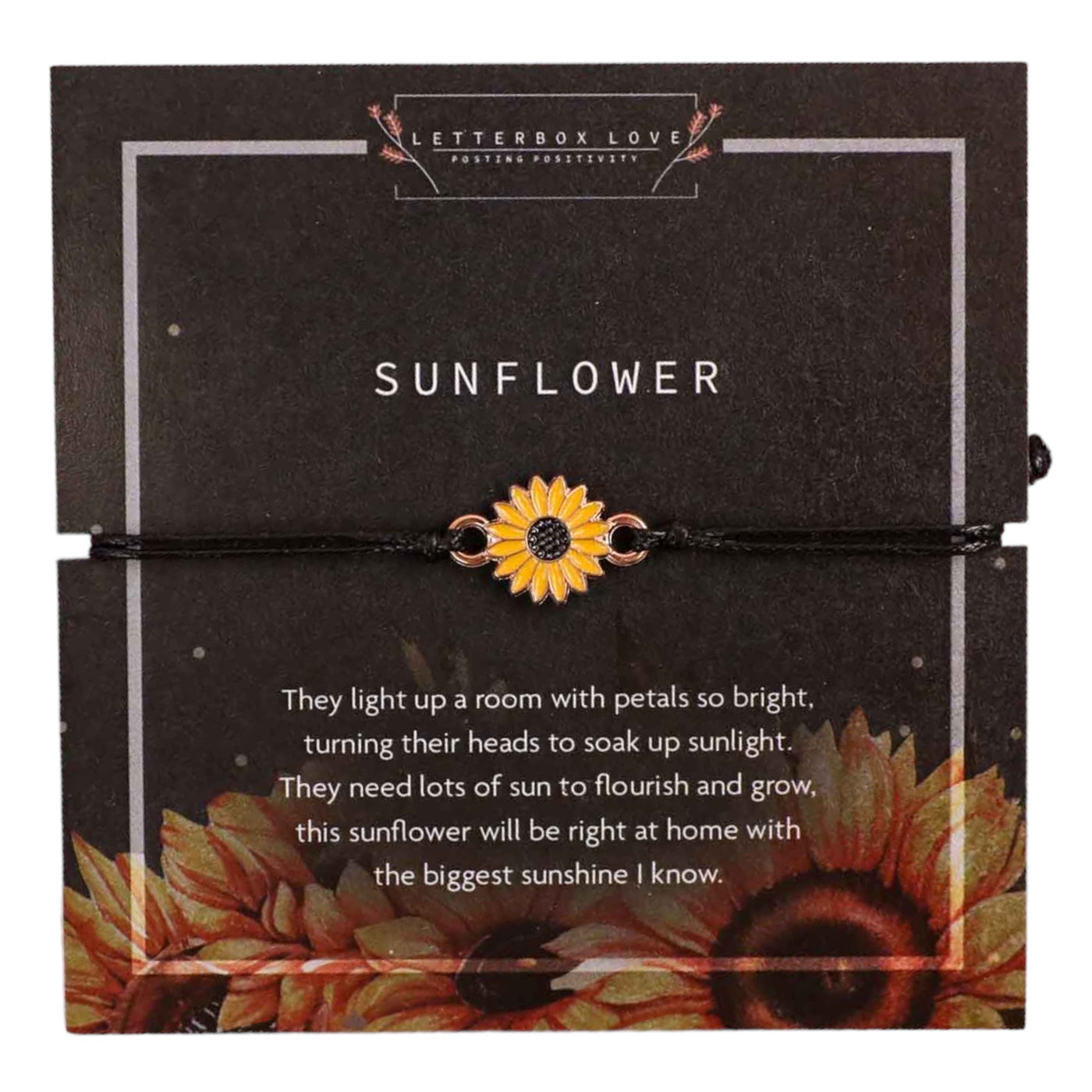 A black cord bracelet with a vibrant, enameled sunflower charm in the center, displayed against a dark background with a sunflower design and text that reads 'SUNFLOWER.' The accompanying text on the card poetically describes the sunflower's bright presence and growth