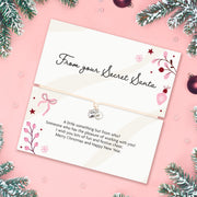 A beautiful Secret Santa gift that reads 'From your Secret Santa' with a joyful poem. With a delicate pearl and heart bracelet. This is the perfect secret Santa gift for under £10 with christmas branches and baubles surrounding the card.