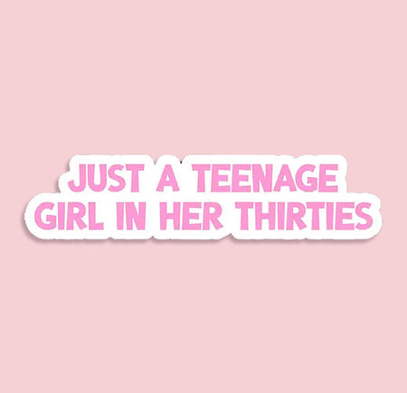 Sticker with text 'Just a teenage girl in her thirties' on a pink background