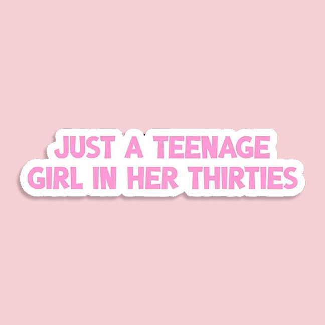 Sticker with text 'Just a teenage girl in her thirties' on a pink background