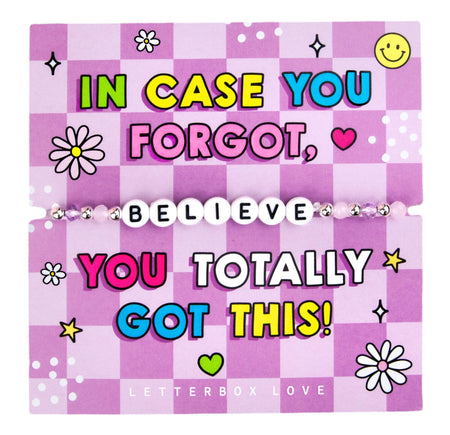 An image of a motivational card featuring a beaded bracelet with white letter beads spelling 