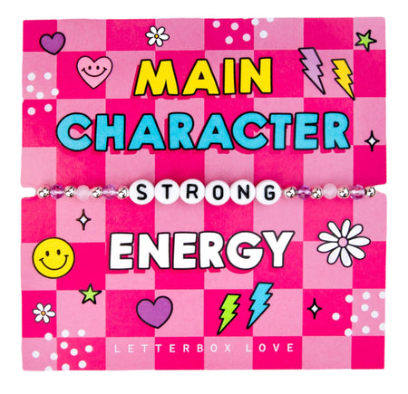 A colorful affirmation bracelet displayed on a bright pink and checkered card with various symbols like smiley faces, hearts, lightning bolts, and flowers. The card reads 