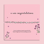 A pink poem card that reads 'a wee congratulations' with a cubic zirconia and silver-plated bracelet. A beautiful gift to celebrate someone's achievements