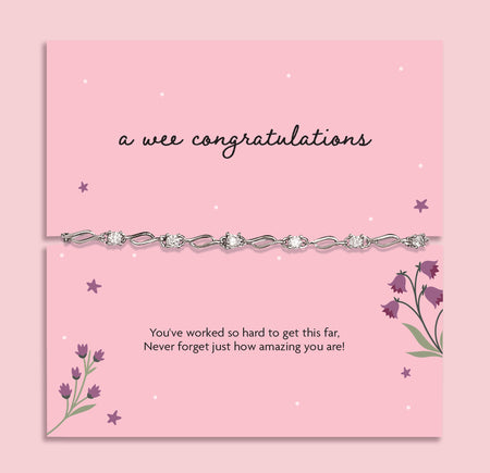 A pink poem card that reads 'a wee congratulations' with a cubic zirconia and silver-plated bracelet. A beautiful gift to celebrate someone's achievements