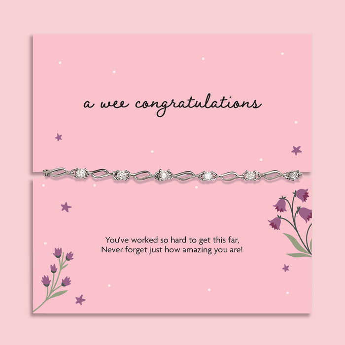 A pink poem card that reads 'a wee congratulations' with a cubic zirconia and silver-plated bracelet. A beautiful gift to celebrate someone's achievements