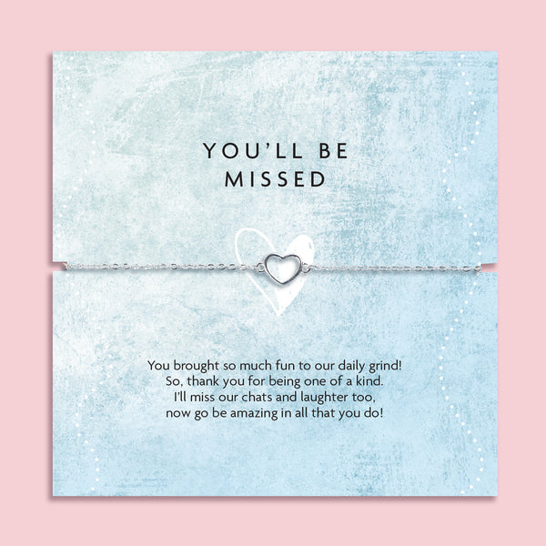 Pale pink background with 'you'll be missed' gift with heartfelt leaving poem. The bracelet is a silver plated hollow heart design. Perfect for a colleague leaving.
