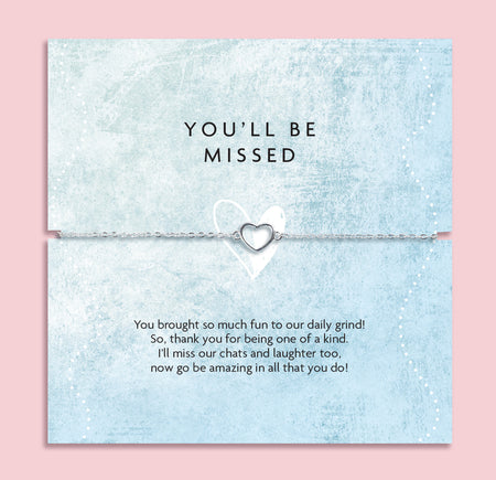 Pale pink background with 'you'll be missed' gift with heartfelt leaving poem. The bracelet is a silver plated hollow heart design. Perfect for a colleague leaving.