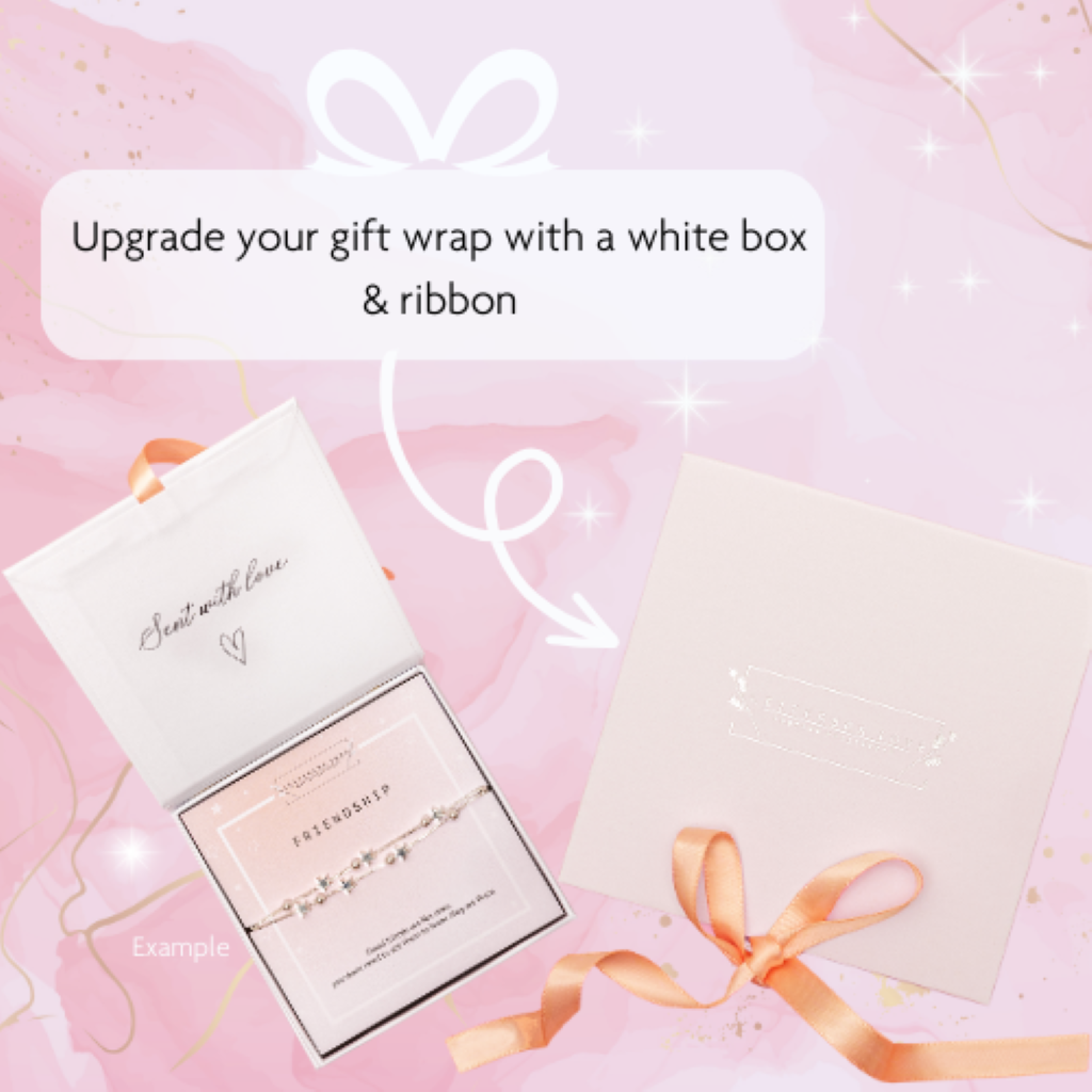 a gift box with a ribbon and a card
